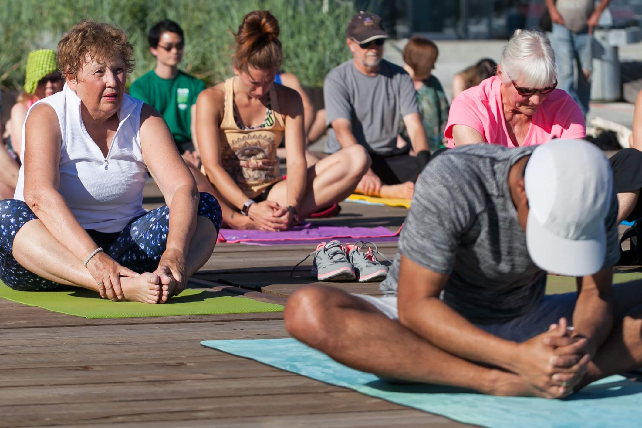 A group of people attend one of NVRC's outdoor yoga fitness programs