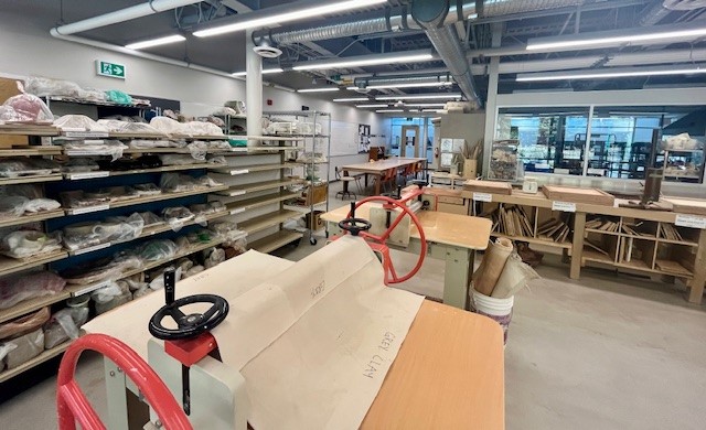 Interior of the pottery studio at the Delbrook Community Recreation Centre, showing the slab rollers and shelving.