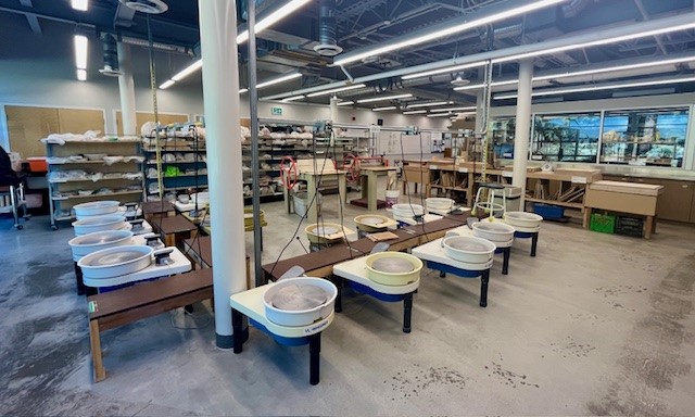 Interior of the pottery studio at the Delbrook Community Recreation Centre, showing the wheel set up.
