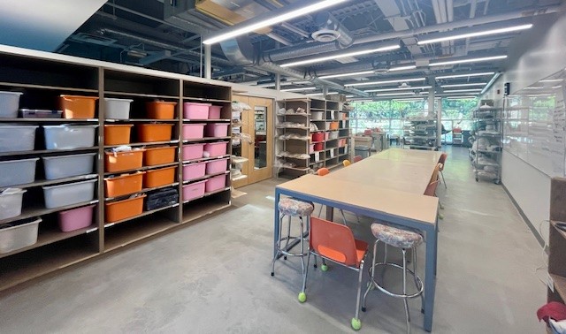 Interior of the pottery studio at the Delbrook Community Recreation Centre, showing tables space and storage.