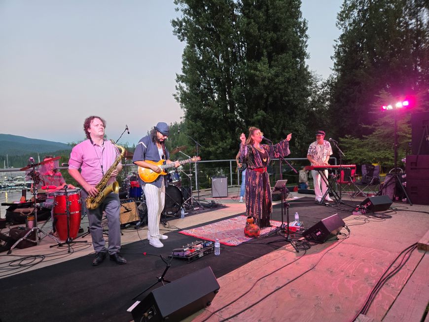 A band performs in Panorama Park, Deep Cove