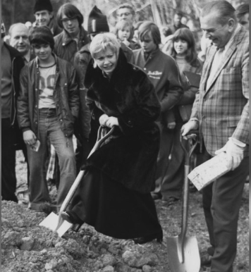 Karen Magnussen shovels dirt next to Mayor Ron Andrews as part of the ground-breaking ceremony for the Karen Magnussen arena.