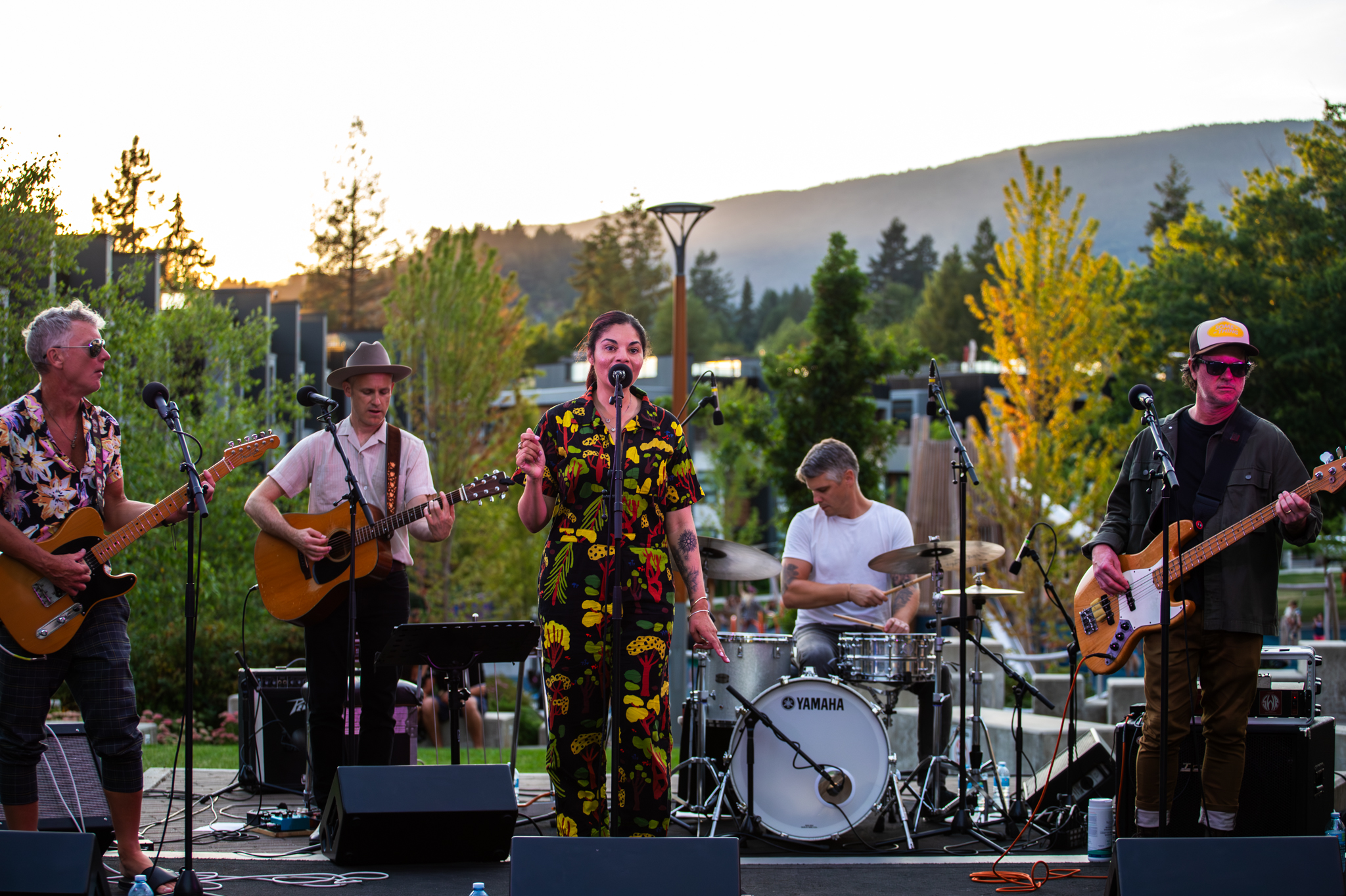 A band perform on a stage in Lions Gate Village. 