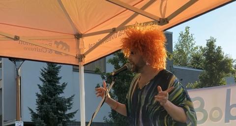 Live & Local Plaza Pop-up host, Phyllis, presents at an event