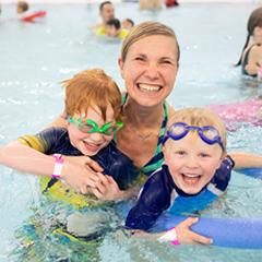 Family swimming in the pool at Delbrook