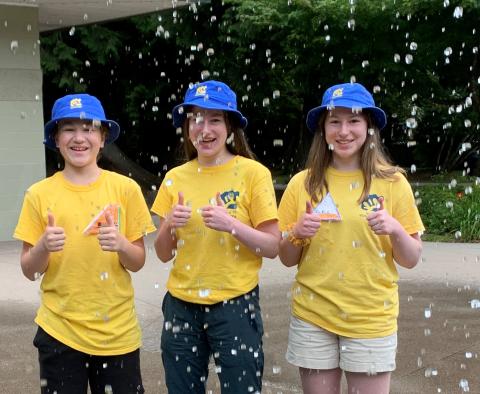 Summer camp volunteers at a splash park