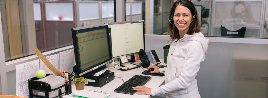 Call centre staff member smiling at camera