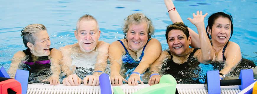 seniors in the pool participating in an aquafit class