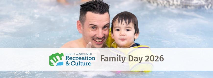 A man and baby smile at the camera while swimming in a pool. 
