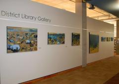 Paintings displayed on gallery wall
