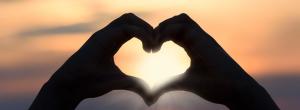 Hands forming the the shape of a heart